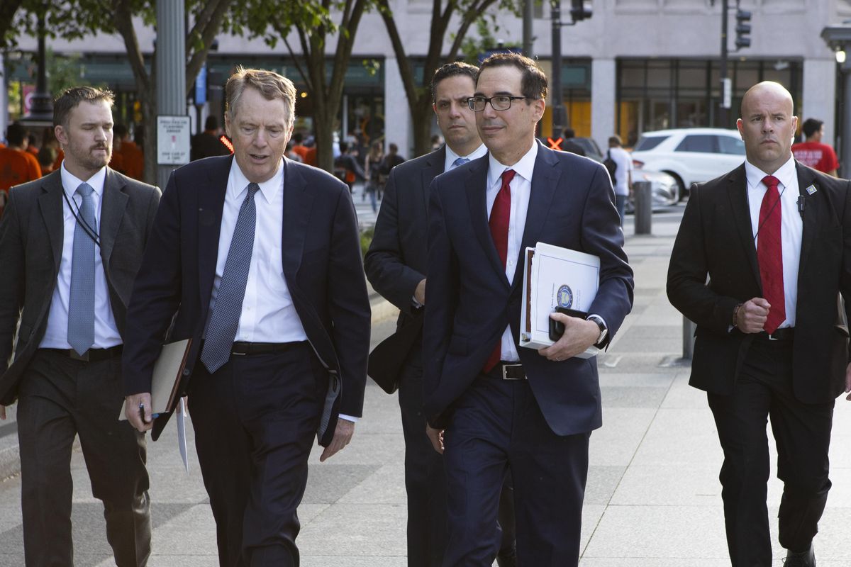 United States Trade Representative Robert Lighthizer, left, and Treasury Secretary Steven Mnuchin walk on Pennsylvania Avenue back to the White House after meeting with Chinese Vice Premier Liu He for trade talks Thursday, May 9, 2019, in Washington. (Jon Elswick / Associated Press)