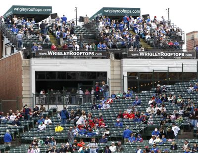 Though some seats remain empty at Wrigley Field Friday, the Cubs’ attendance is good.  (Associated Press)