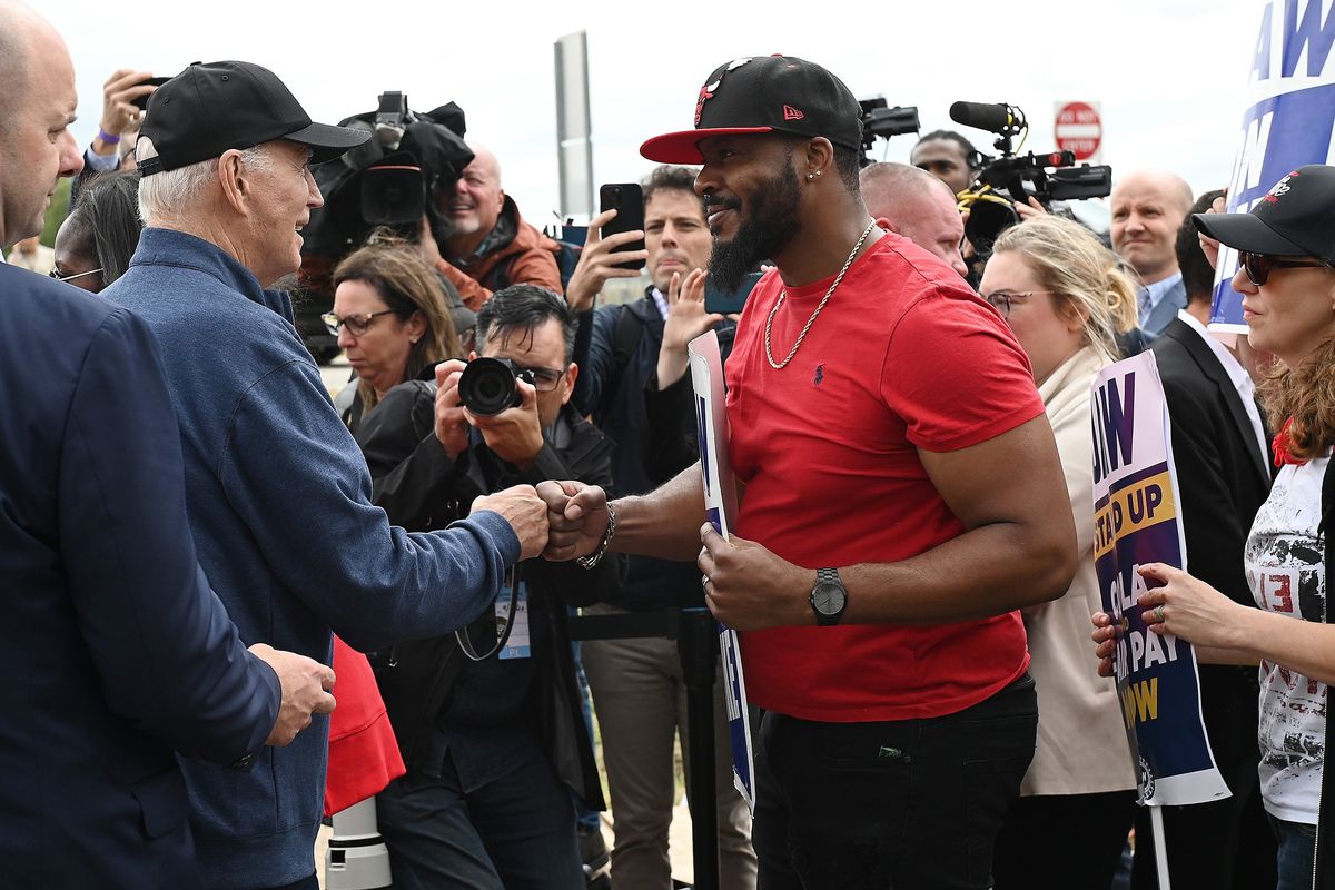 President Joe Biden, left, greets striking UAW Local 174 members after the rally at GM Willow Run Redistribution Center on Sept. 26, 2023, in Belleville, Michigan. (Clarence Tabb Jr./The Detroit News/TNS)  (Clarence Tabb Jr./The Detroit News/TNS)