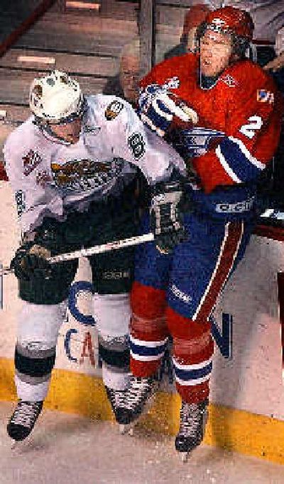 
Everett's Graham Potuer, left, drills Chief Sean Zimmerman into boards.
 (Brian Plonka / The Spokesman-Review)