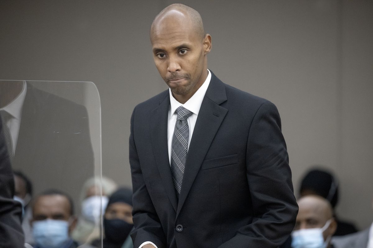FILE - Former officer Mohamed Noor makes his way to the podium to address Judge Kathryn Quaintance at the Hennepin County Government Center on Oct. 21, 2021 in Minneapolis. The Minneapolis police officer who fatally shot an unarmed woman after she called 911 to report a possible rape happening behind her home was sentenced to nearly five years in prison. Data show it's rare for police officers to be convicted of on-duty killings. But three recent convictions of police officers in Minnesota have some people wondering whether that's changing.  (Elizabeth Flores)