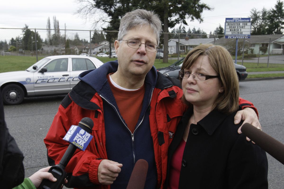 Ken and Cindy Paulson, the father and stepmother of slain teacher Jennifer Paulson, talk to reporters Friday outside Birney Elementary School in Tacoma, where Jennifer Paulson was fatally shot earlier in the morning.  (Associated Press)