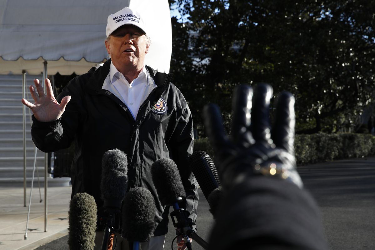 President Donald Trump gestures as a reporter raises her hand to ask a question, as he speaks to the media on the South Lawn of the White House, Thursday Jan. 10, 2019, in Washington, en route for a trip to the border in Texas as the government shutdown continues. (Jacquelyn Martin / Associated Press)