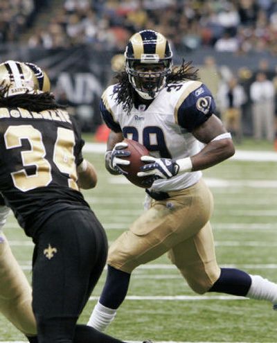 
St. Louis's Steven Jackson threw a pass for a touchdown to tight end Randy McMichael.Associated Press
 (Associated Press / The Spokesman-Review)