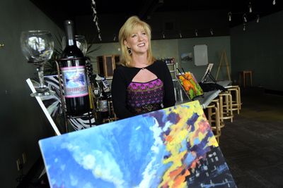Cindi Schneider is pictured at her gallery, Painting with Spirits, in Coeur d’Alene on Oct. 9.  (Kathy Plonka / The Spokesman-Review)