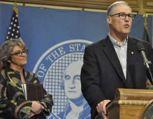 OLYMPIA -- Gov. Jay Inslee announces that Cheryl Strange, left, has been named chief executive officer of Western State Hospital after the dismissal of current CEO Ron Adler. (Jim Camden/The Spokesman-Review)