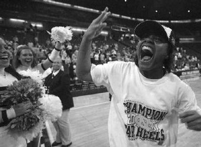 
North Carolina's Ivory Latta is all smiles after scoring 21 points in the Dallas Regional final.
 (Associated Press / The Spokesman-Review)