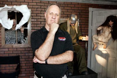 
Leonard Pickel, publisher of Haunted Attraction magazine, at one of the booths at the Hauntcon convention in Denver. Pickel, one of the sponsors of the convention, estimates that haunted houses nationwide generate $300 million every year.
 (Associated Press / The Spokesman-Review)