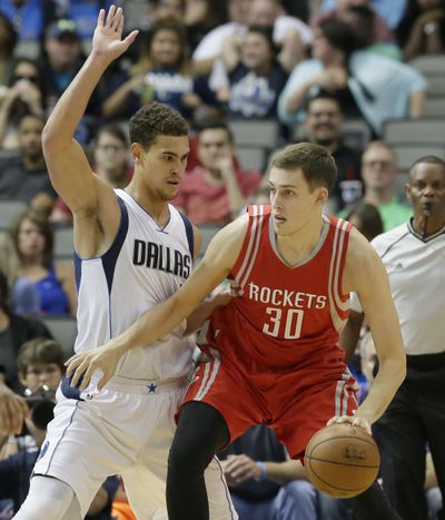 Houston’s Kyle Wiltjer dribbles against Dallas Mavericks forward Dwight Powell in an October game. (LM OTERO / Associated Press)