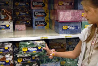 
Adams Elementary fifth-grader Melissa McGuire picks out a box of Kleenex at Target.
 (The Spokesman-Review)