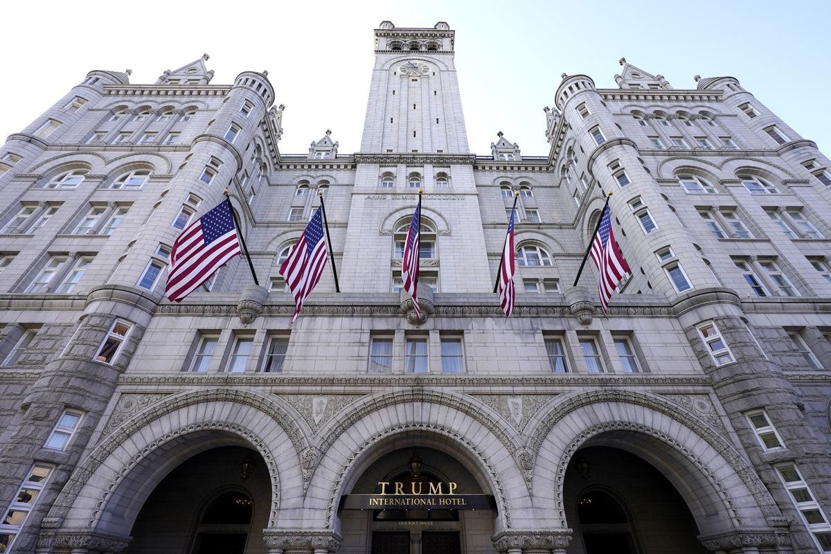 FILE - A view of The Trump International Hotel is seen, March 4, 2021, in Washington. Former President Donald Trump’s businesses and inaugural committee have reached a deal to pay Washington, D.C., $750,000 to resolve a lawsuit that alleged the committee overpaid for events at the Trump International Hotel and enriched the former president’s family in the process. That
