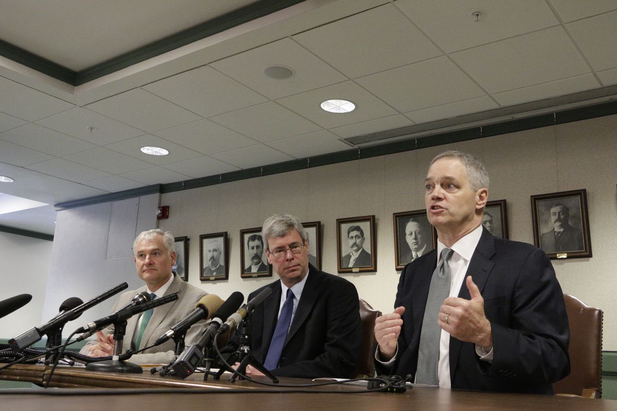 Democratic Rep. Ross Hunter, right, talks to the media about the latest budget proposal as House Majority Leader Pat Sullivan, center, and Rep. Reuven Carlyle listen on Monday in Olympia. (Associated Press)