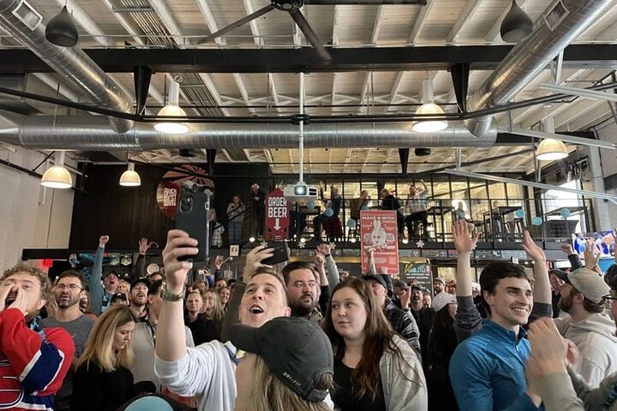 Fans react after the Spokane Velocity scored their first goal Saturday against the Greenville Triumph. Fans gathered at Brick West Brewing Co. for the professional soccer team’s first watch party.  (Garrett Cabeza / The Spokesman-Review)