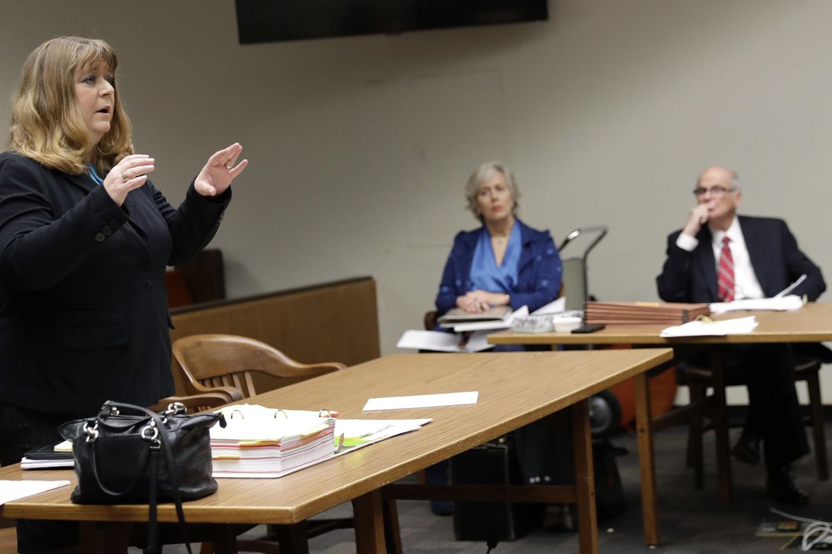 Michele Earl-Hubbard, left, the attorney for a media coalition led by The Associated Press, speaks in Thurston County Superior Court, Friday, Jan. 19, 2018 in Olympia, Wash. (Ted S. Warren / AP)