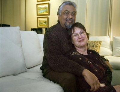 
Jay Lal holds his wife Jo at their Spokane home. Jo is donating a kidney to a stranger so Jay can move to the top of the kidney transplant list. Jay has failing kidneys due to the anti-rejection medications he takes since his heart transplant nine years ago. 
 (CHRISTOPHER ANDERSON / The Spokesman-Review)