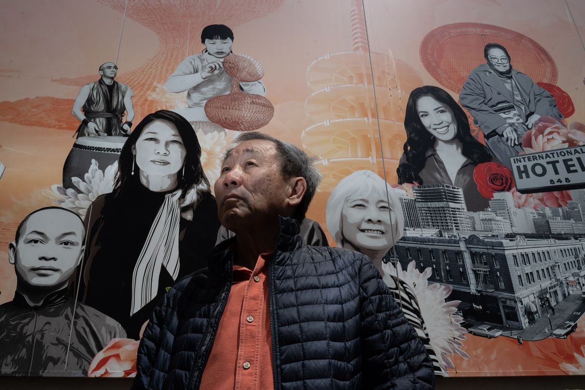 Norman Wong stands before a mural in San Francisco’s Chinatown honoring important Chinese Americans, including his great-grandfather Wong Kim Ark, bottom left. (Brian L. Frank/For The Washington Post)