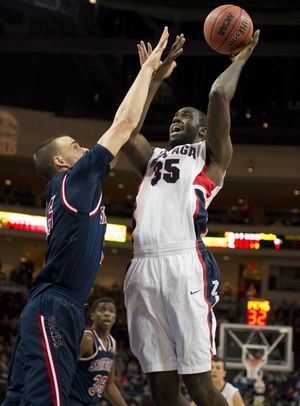 Gonzaga Bulldogs forward/center Sam Dower (35) shoots over St. Mary's Gaels forward Beau Levesque (15) during the first half of a WCC tournament semifinal men's college basketball game, Monday, March 10, 2014, in Las Vegas, Nevada. (The Spokesman-Review)