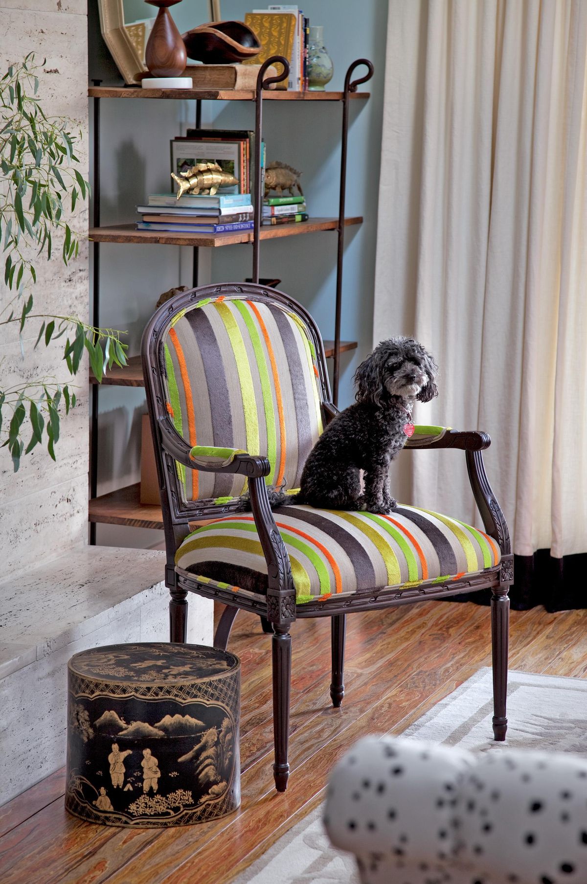 Reupholstering furniture can be done with a few simple tools, patience and time, according to Amanda Brown, author of “Spruce: A Step-by-step Guide to Upholstery and Design” (Storey, 2013), which takes readers through six projects including this Louis XVI chair reupholstered in a neon velvet stripe by Designers Guild. (Ryann Ford / Ryann Ford/Storey Publishing via Associated Press)