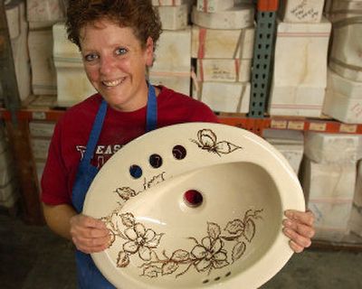 
Jo Sandburg-Smith handpaints and stencils old sinks. 
 (The Spokesman-Review)