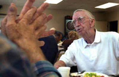 
Retired book publisher and editor and longtime political worker Al Eiland, 80, talks politics during a recent senior lunch at the Southside Activity Center. 
 (Jed Conklin / The Spokesman-Review)