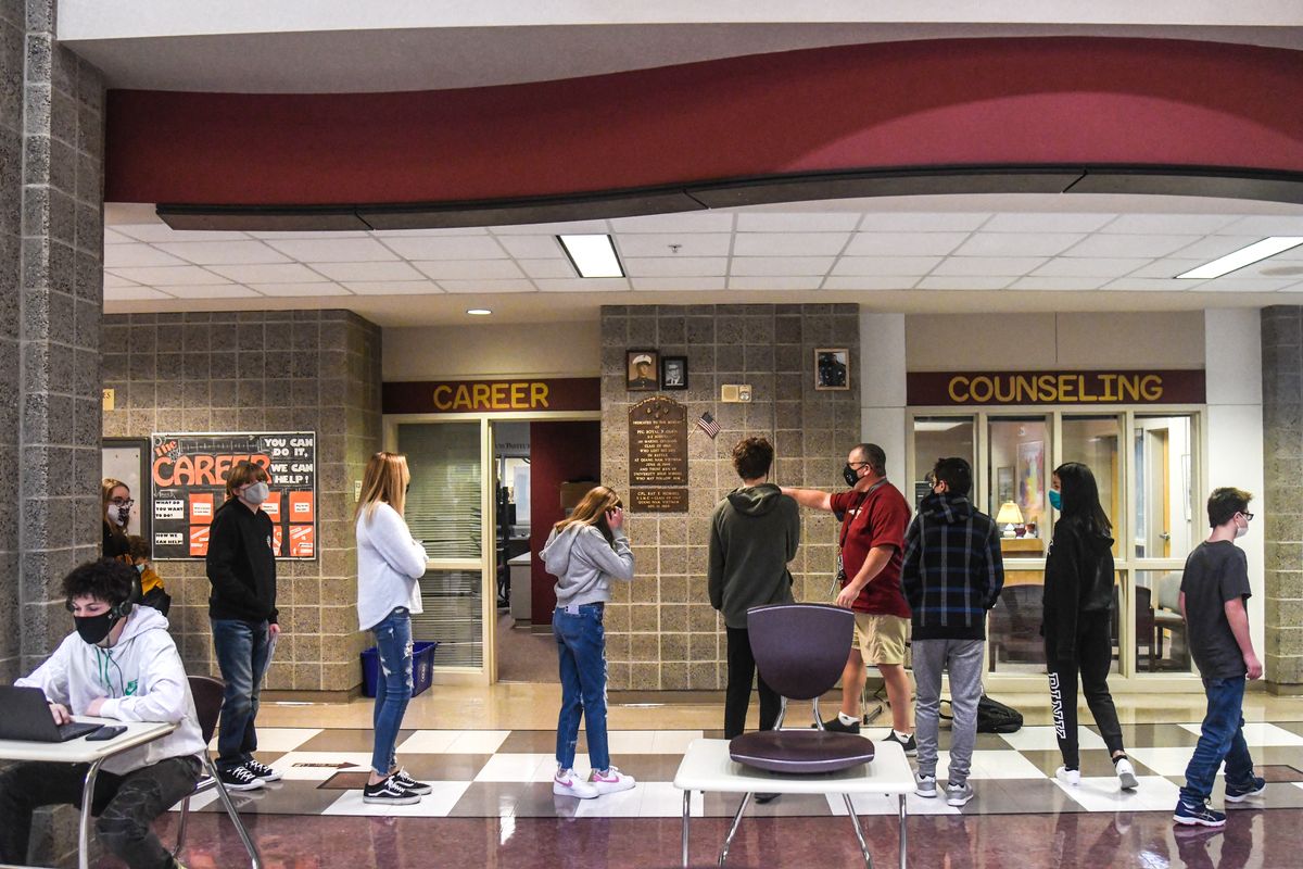 University High School freshman tour the school halls for on the first day of in-person learning, Monday, Feb. 1, 2021, in Spokane Valley, Wash.  (DAN PELLE/THE SPOKESMAN-REVIEW)