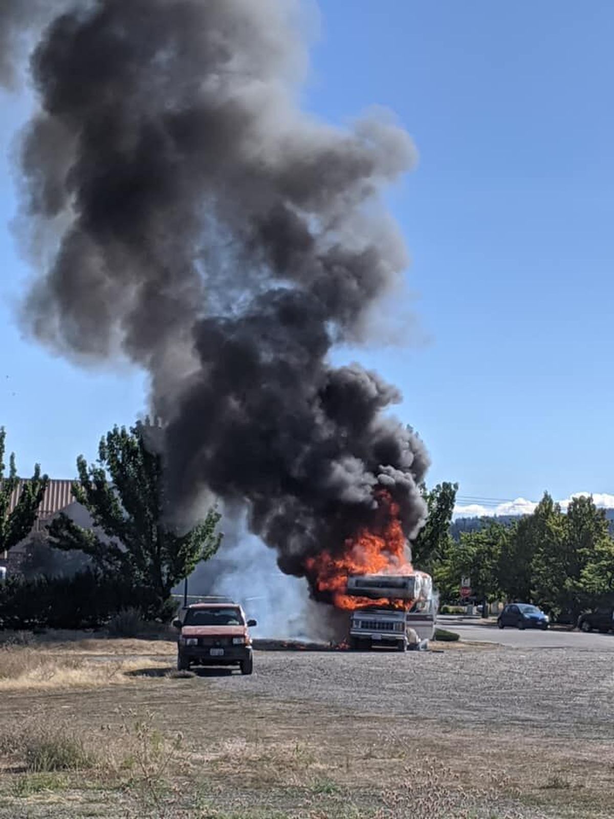 A camper is engulfed in flames Saturday, Aug. 22, 2020, in Liberty Lake. The vehicle was destroyed.  (Courtesy of SVFD Facebook)