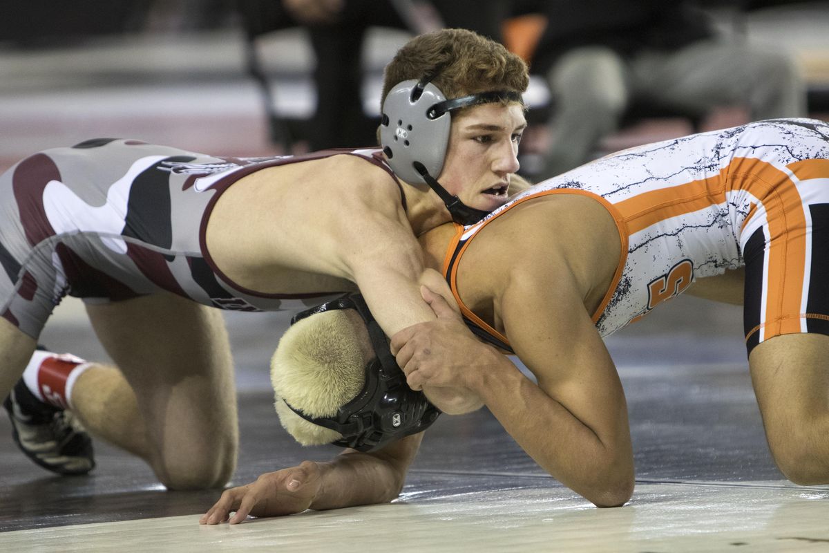 Colville’s Trent Baun controls Zillah’s Joel Coronel from the top in their 126-pound State 1A championship match last Saturday  in Tacoma. (Patrick Hagerty / For The S-R)