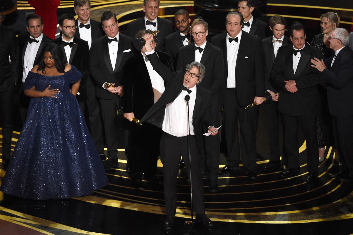 Peter Farrelly, center, and the cast and crew of "Green Book" accept the award for best picture at the Oscars on Sunday, Feb. 24, 2019, at the Dolby Theatre in Los Angeles. (Chris Pizzello / Associated Press)