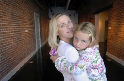 
Megan Murphy stands with her daughter, Murphy Kendall, 5, in the Saranac Building. 
 (Dan Pelle / The Spokesman-Review)