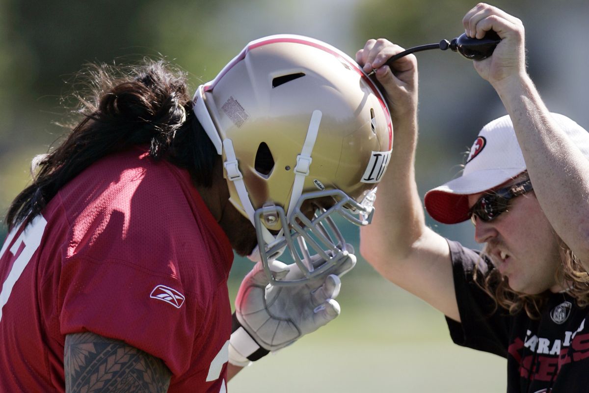 San Francisco 49ers guard Mike Iupati, a first-round draft pick from Idaho, is helped with his helmet during rookie football mini-camp at 49ers headquarters in Santa Clara, Calif., Friday, April 30, 2010. (Paul Sakuma / Associated Press)