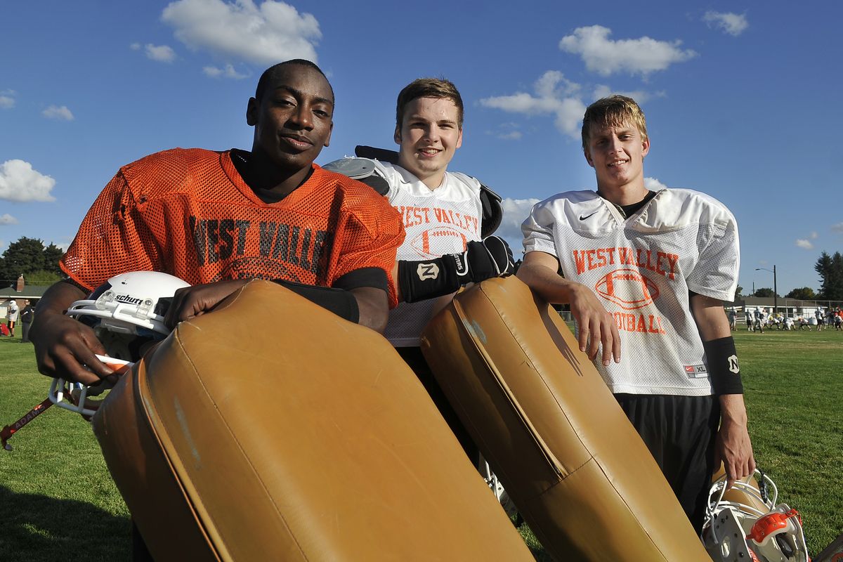From left, Terrynce Duke (slot receiver and defensive back), Trevor Cooper (running back and defensive back) and Tyler Stavnes (quarterback and cornerback) are the core of the offense for the West Valley Eagles. (Jesse Tinsley)