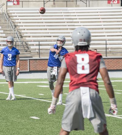 Washington State quarterback Luke Falk throws to one of his favorite targets, Tavares Martin Jr., during practice Wednesday at Martin Stadium. (Jesse Tinsley / The Spokesman-Review)