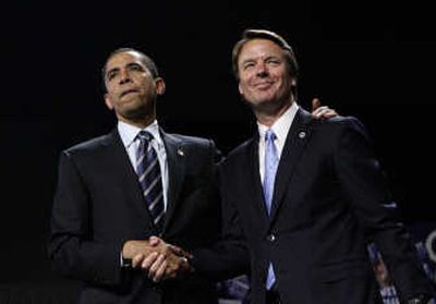 
Presidential hopeful Sen. Barack Obama is joined by former candidate  John Edwards  in Grand Rapids, Mich., on Wednesday. Associated Press
 (Associated Press / The Spokesman-Review)
