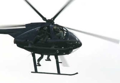 
A helicopter owned by Blackwater USA, a  security contractor, flies over central Baghdad in February. Associated Press
 (File Associated Press / The Spokesman-Review)