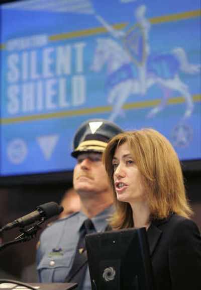 
State Attorney General Anne Milgram speaks at a news conference in Trenton earlier this month to announce the arrests of 41 people in New Jersey on child porn charges. Those arrested are charged with sending child rape photos and videos over the Internet, including many who used popular social networking sites such as MySpace and Facebook, state police said. With Milgram is state police Maj. James Fallon. Associated Press
 (Associated Press / The Spokesman-Review)