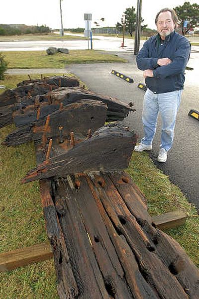 
Dan Evans, director of the Ocean Shores Interpretive Center, hopes to identify the source of a piece of a shipwreck that washed up on the city's beach. Associated Press
 (Associated Press / The Spokesman-Review)