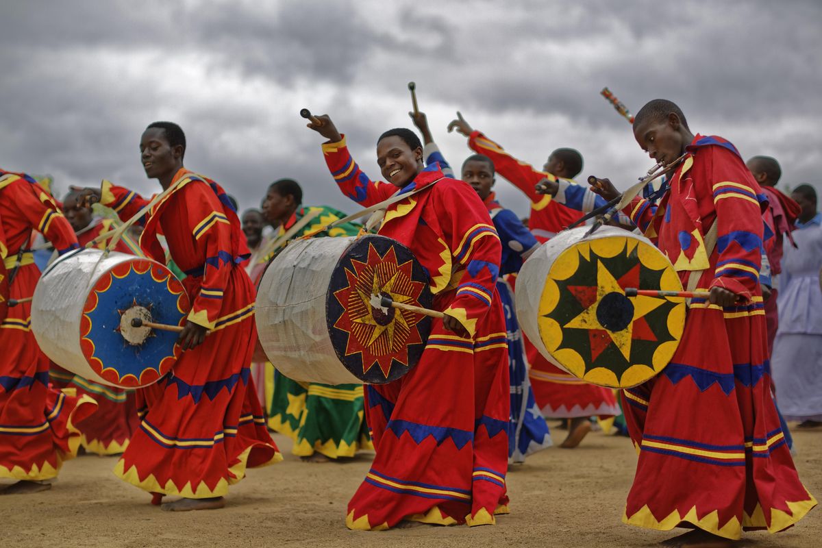 Members of the International Apostolic Ejuwel Jekenisheni Church dance, sing, pray, and play drums during a morning service at the open-air church on the outskirts of Harare, Zimbabwe Sunday, Nov. 19, 2017. (Ben Curtis / Associated Press)