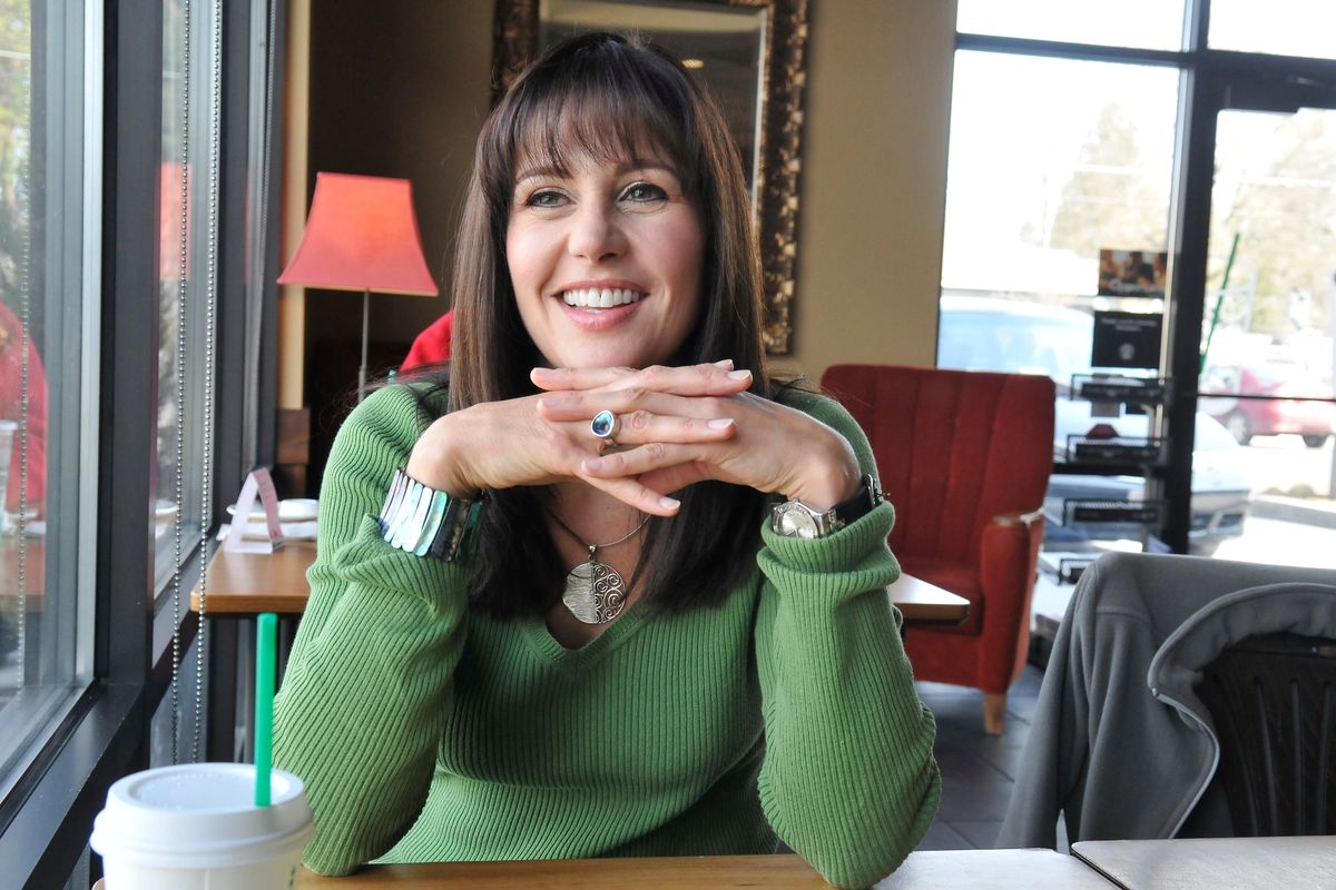 Dawn Picken, a longtime TV personality in Spokane, sits April 9, 2012, in a South Hill Starbucks. She had recently moved back to Spokane looking for work. Before that, she took a long trip around the world with her two young children, living in New Zealand for several months, following the death of her husband, Sean.  (JESSE TINSLEY/The Spokesman-Review)