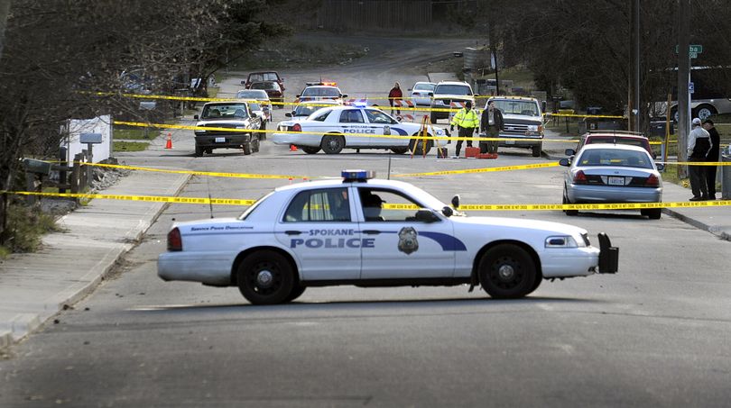 Spokane police block  the scene of an officer-involved shooting in the 4100 block of East 36th Avenue  in south Spokane  on Friday. (CHRISTOPHER ANDERSON)