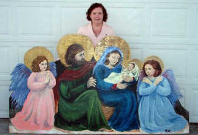 
Willa Cahill stands behind the Nativity scene she painted. Cahill says she is a full-time homemaker and a part-time artist
 (GLORIA WARNICK / The Spokesman-Review)