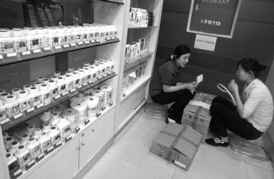 
Workers sort through inventory last month at a Beijing drugstore. As China's share of Americ's drug and vitamin markets grows, concerns are also on the rise about quality control. 
 (Associated Press / The Spokesman-Review)