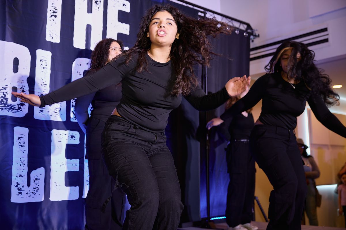 Members of the Step Team Alliance perform at The Black Lens relaunch party Feb. 2 at the Steam Plant rooftop event center.  (Ulysses Curry/Innatai Foundation)