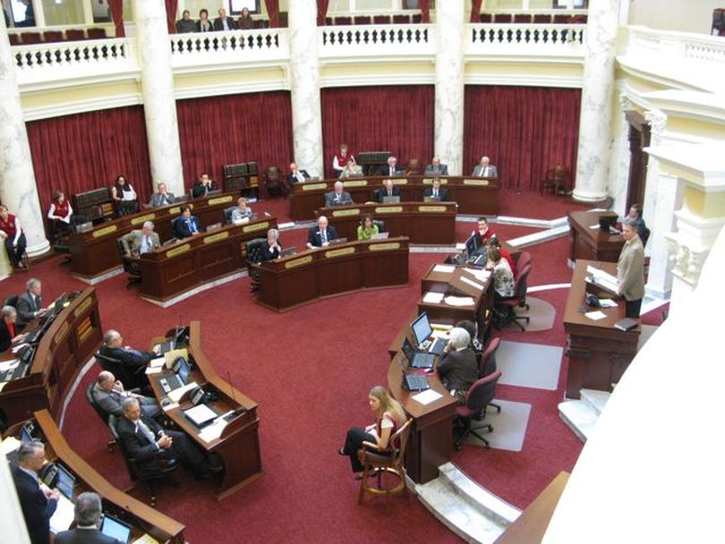 The Idaho Senate debates chicken-farming legislation on Monday. Senators passed a bill to set up a board to regulate an expected glut of chicken farms moving from California on a 24-11 vote, and also passed, 34-1, legislation to make cockfighting a felony in Idaho. Both measures were sponsored by Sen. Tim Corder, R-Mountain Home; both bills now move to the House. (Betsy Russell)