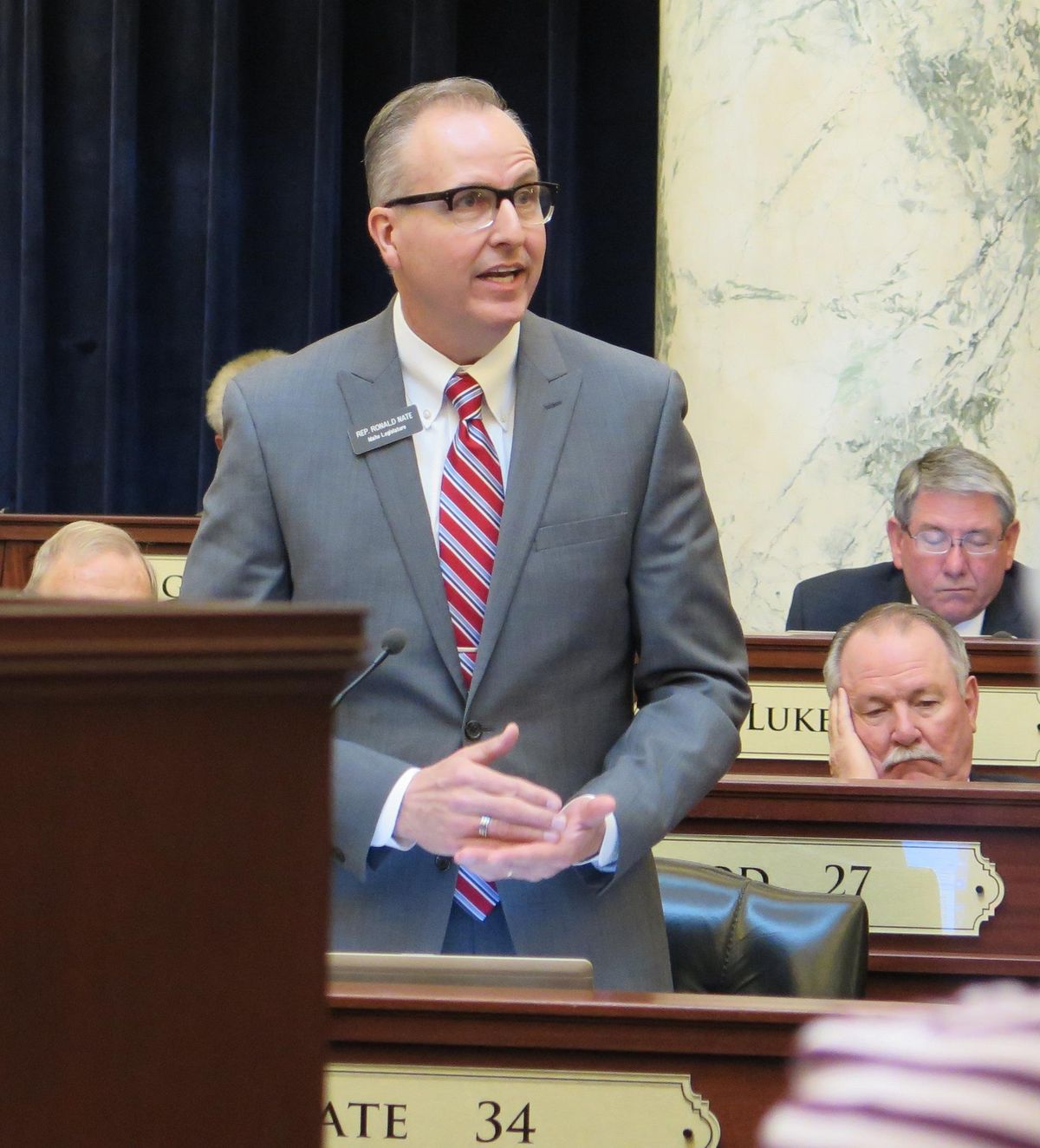 Idaho state Rep. Ron Nate, R-Rexburg, speaks on the floor of the House. Nate is leading a group of 30 lawmakers suing to overturn Gov. Butch Otter’s veto of legislation to repeal the state’s grocery tax. (Betsy Z. Russell / SR)