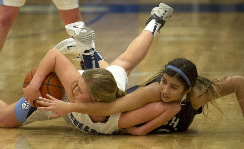 Gonzaga Prep’s Laura Stockton, left, and Chiawana’s Darbi Pink scramble for a loose ball during the first half. (Colin Mulvany)