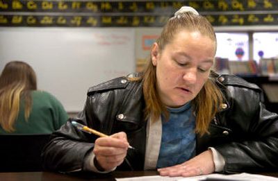 
Andrea Pidliskey works through a reading exercise last week at the Adult Education Center. 