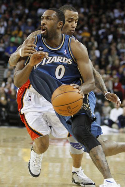 Gilbert Arenas had 45 points, 13 assists as Wizards defeated Warriors in NBA.  (Associated Press)