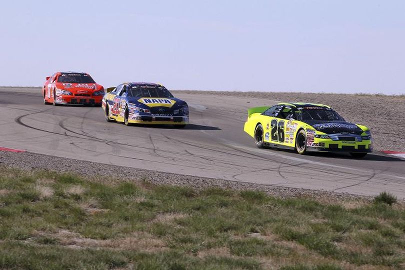 Greg Pursley (26) leads the way en route to his win at Miller Motorsports Park. (Photo Credit: Jeff Botarri/Getty Images for NASCAR) (Jeff Bottari / Getty Images North America)