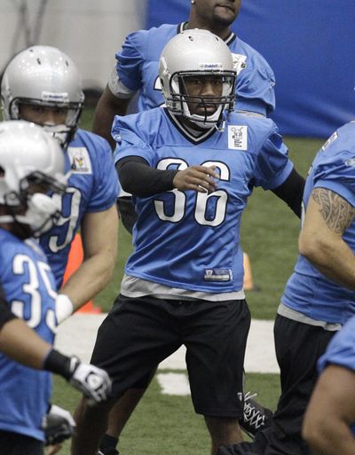 Washington State standout and current Detroit Lions running back Jerome Harrison warms up before drills at the team’s training camp. (Associated Press)