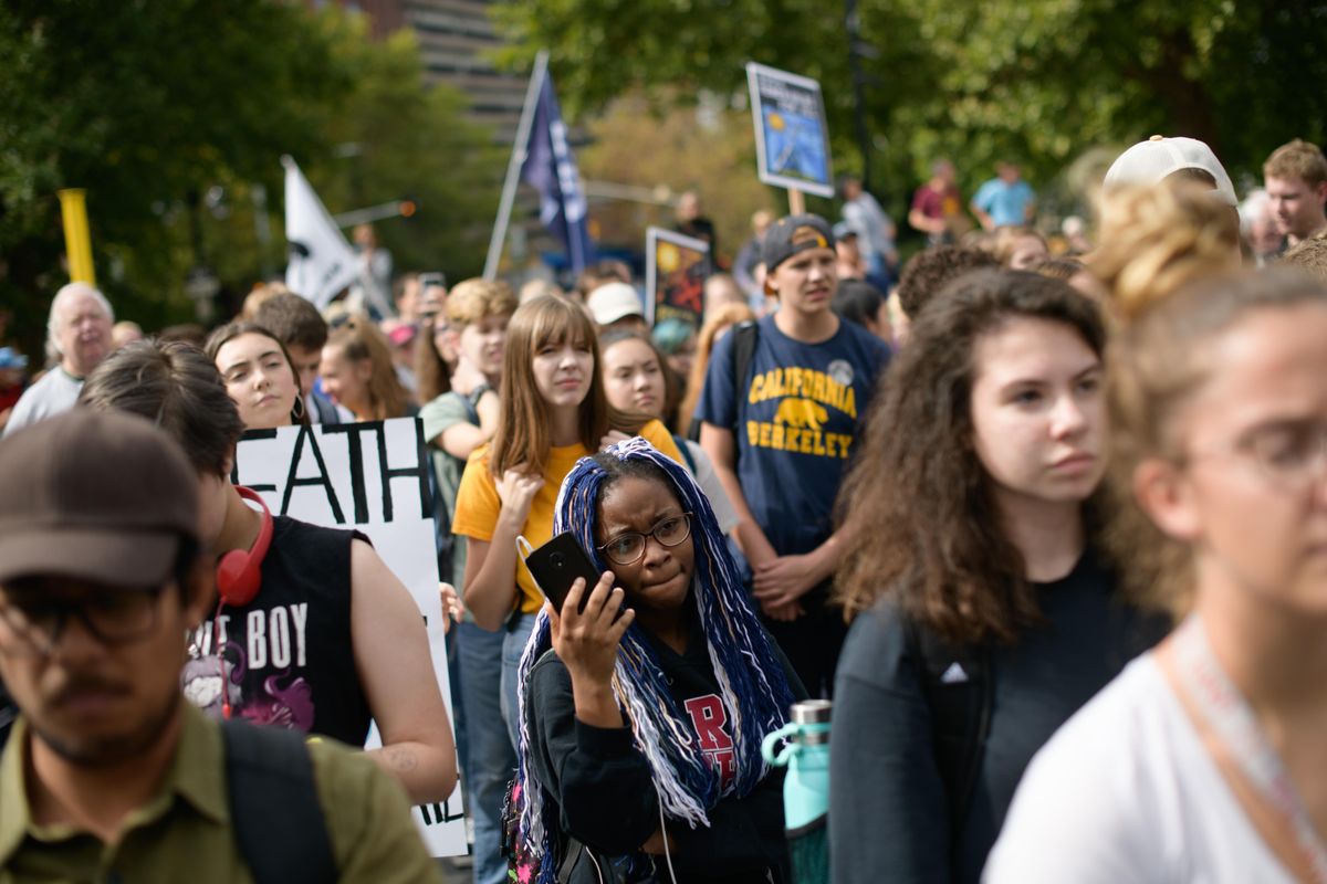 Students gather during a student-led climate protest on Friday, Sept. 20, 2019, at Riverfront Park in Spokane, Wash. (Tyler Tjomsland / The Spokesman-Review)